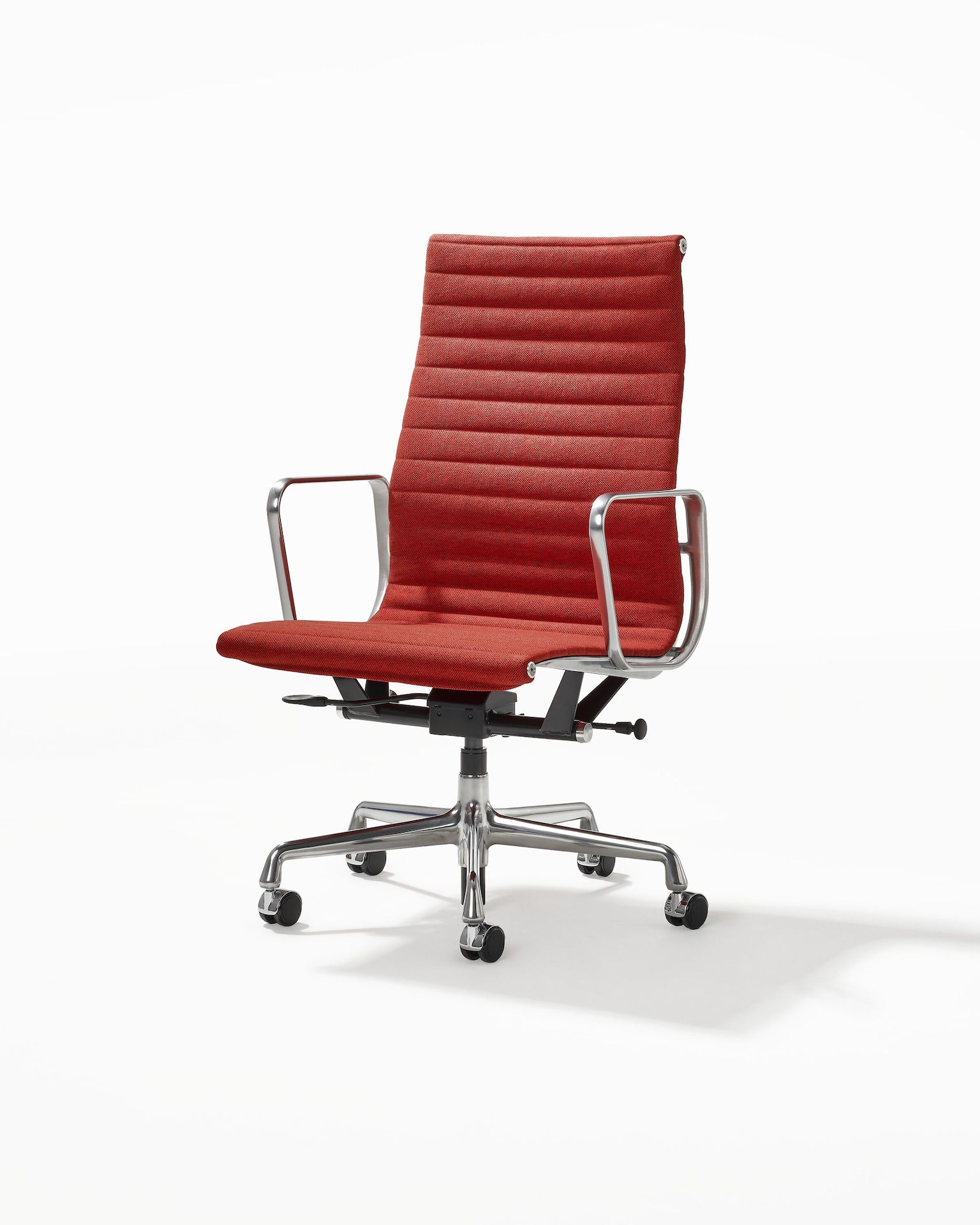 Eames Aluminum Group Chair, Executive Height in red orange upholstery.