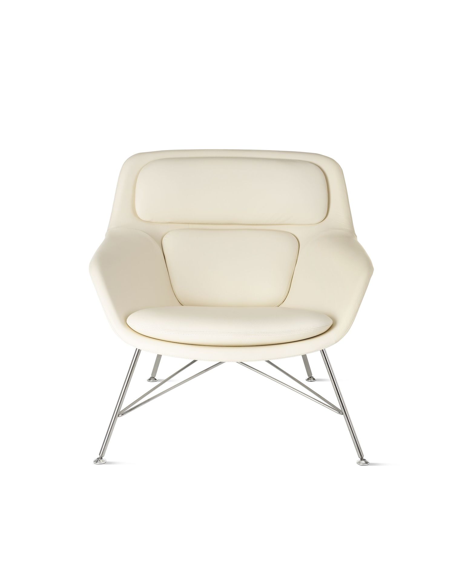 Striad Lounge Chair, Low Back in cream leather on white background.