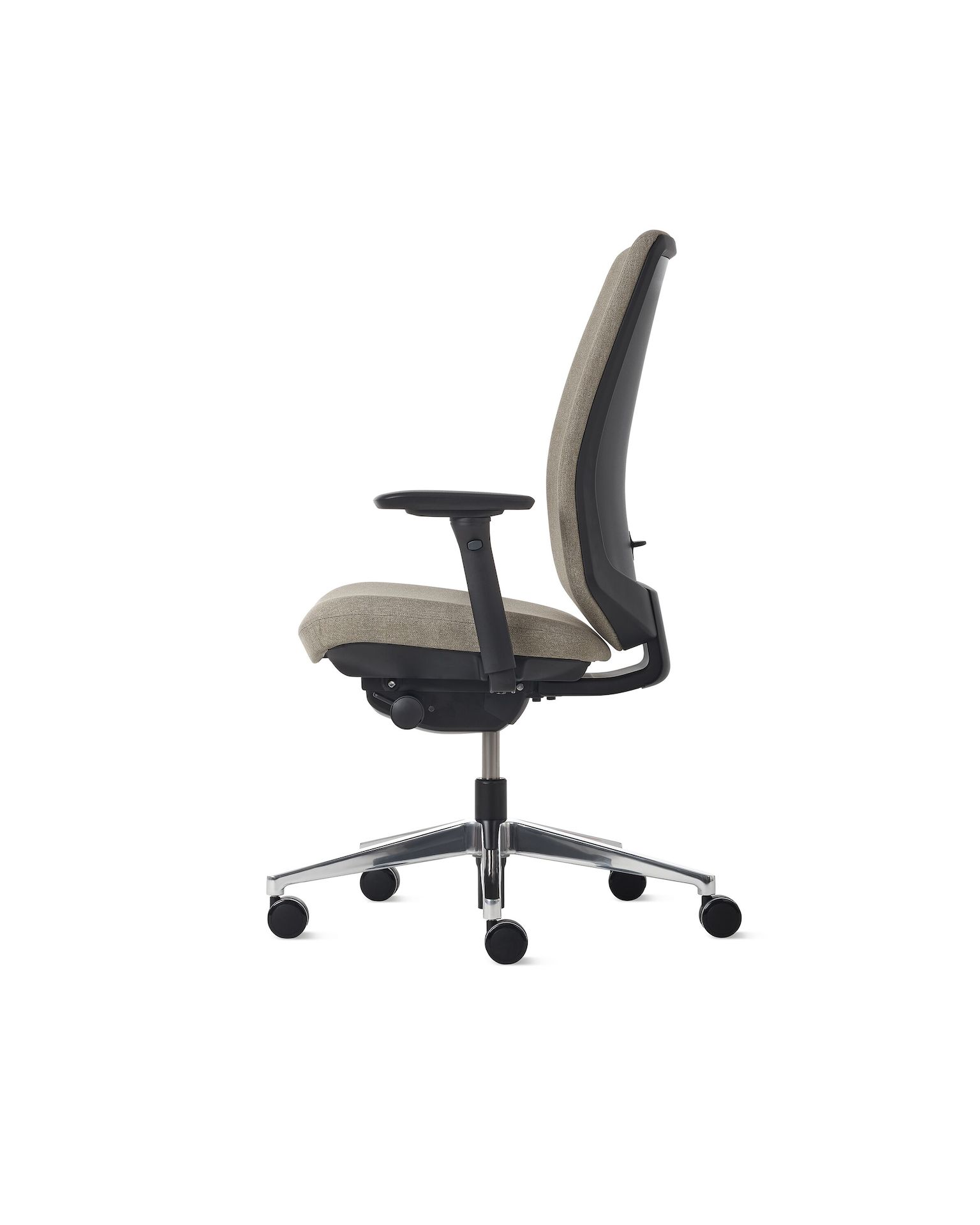 Side view of a Verus chair with beige upholstery  and a polished base. 