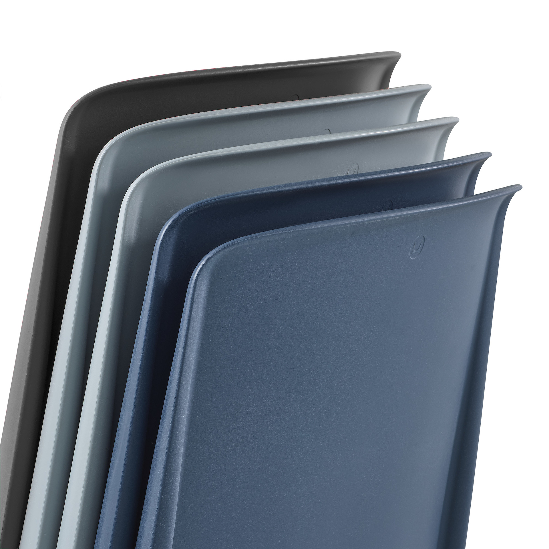 A detail photograph showing the back of 5 Pronta Stacking Chairs in black, glacier (light blue), and peacock (darker blue) colorways.