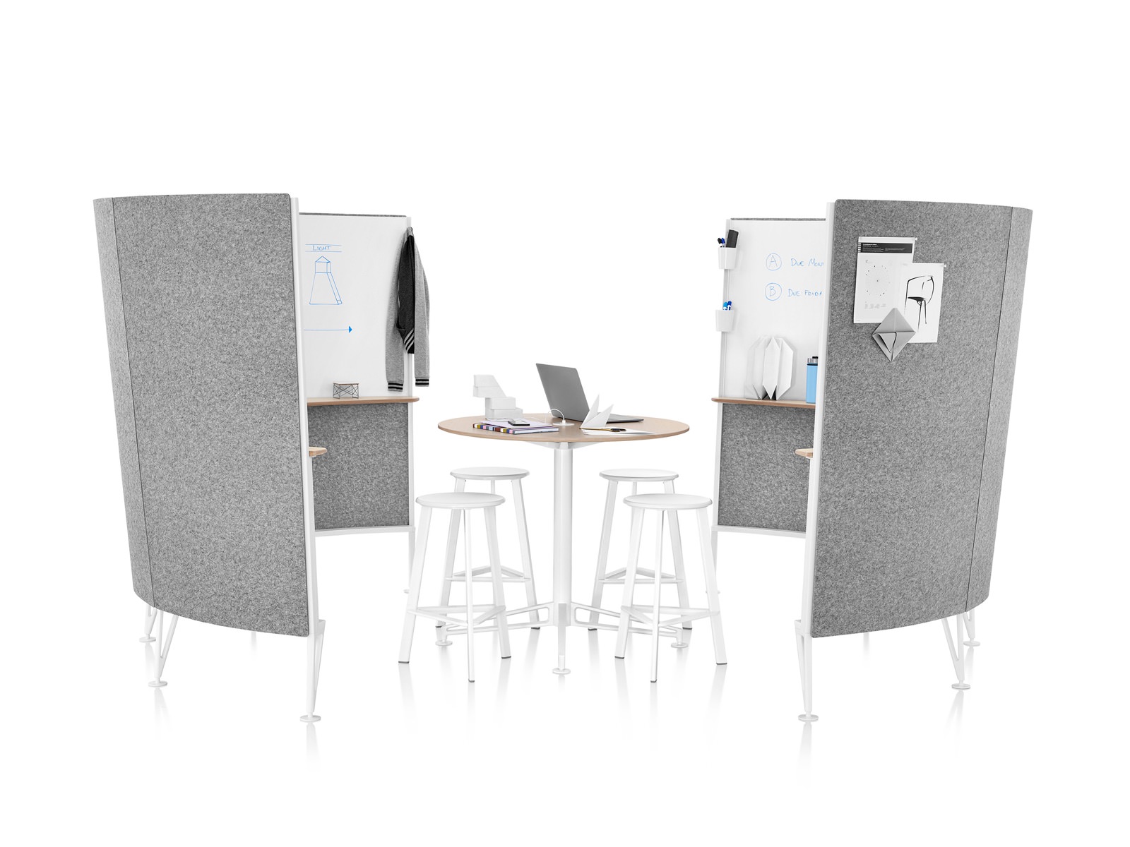 Two four-panel screens with gray acoustic fabric form a semi-enclosed Prospect Creative Space containing a high table and four stools.