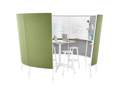 A view inside a Prospect Creative Space with green acoustic fabric on the outside and sketches on the whiteboards inside.