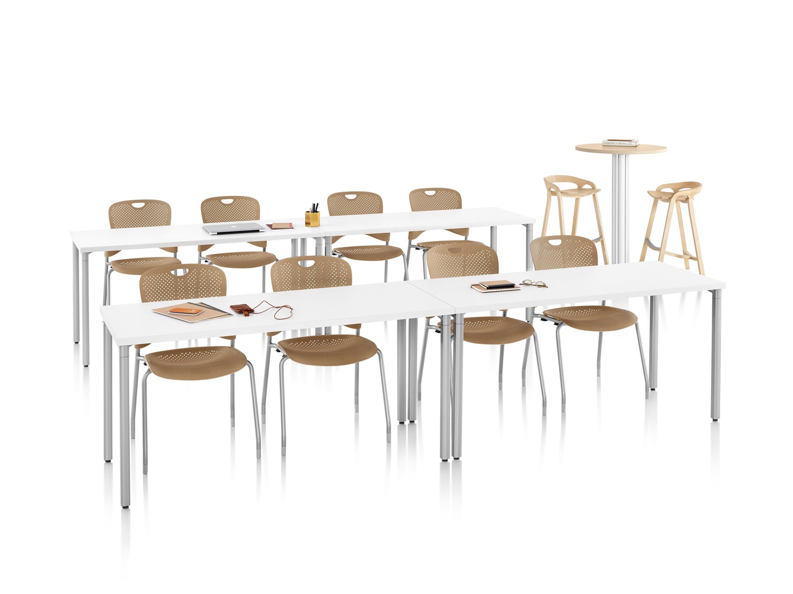 A training or presentation space with two rows of rectangular Everywhere Tables and light brown Caper Stacking Chairs.