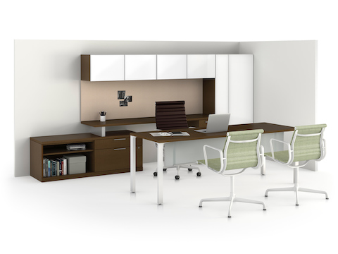 A Canvas Private Office with a rectangular desk in the foreground and a credenza, overheads, and tower storage along the back wall.