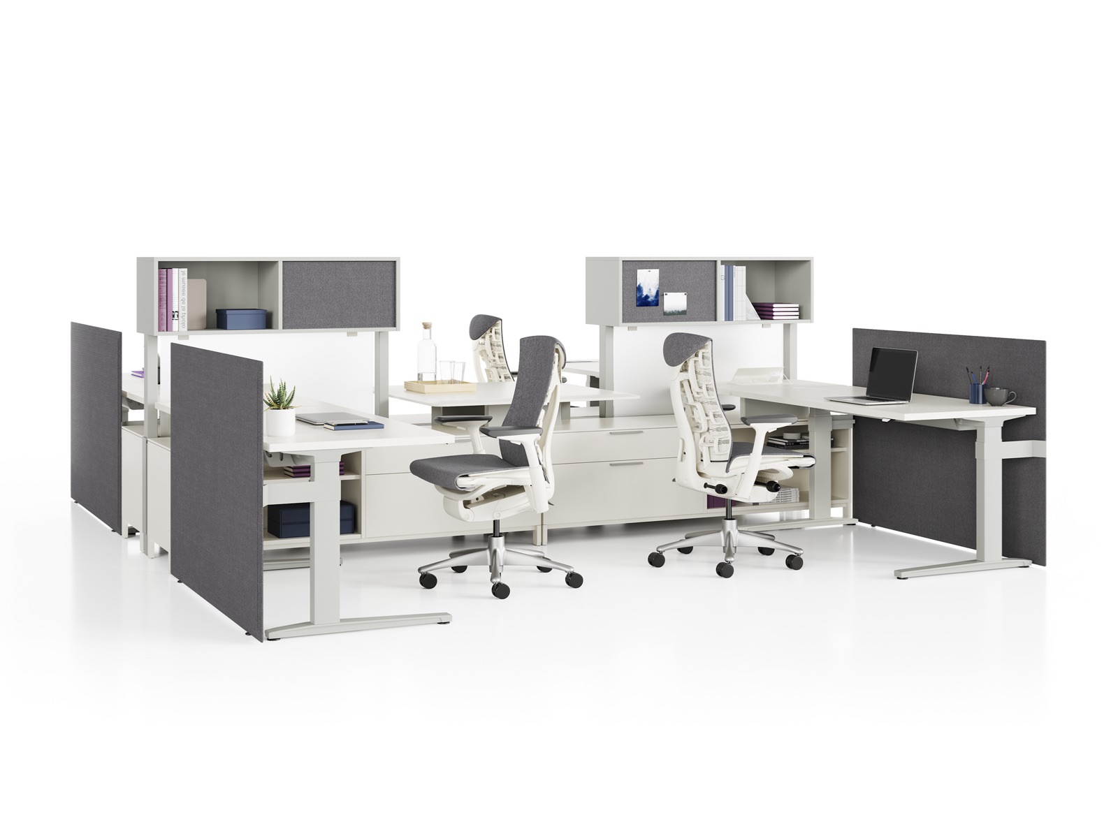 Canvas Dock workstations with sit-to-stand tables, storage, grey screens, and grey Embody Chairs.