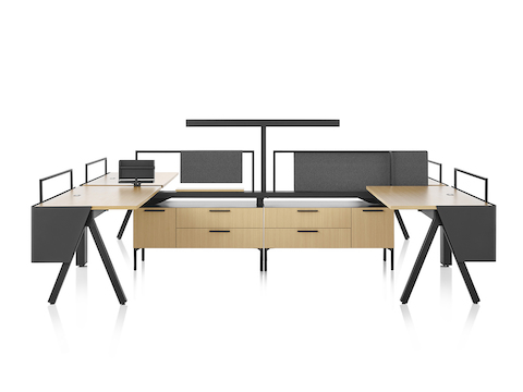 Brown and black Canvas Vista workstations with a-shaped legs, modesty screens and t-shaped light.