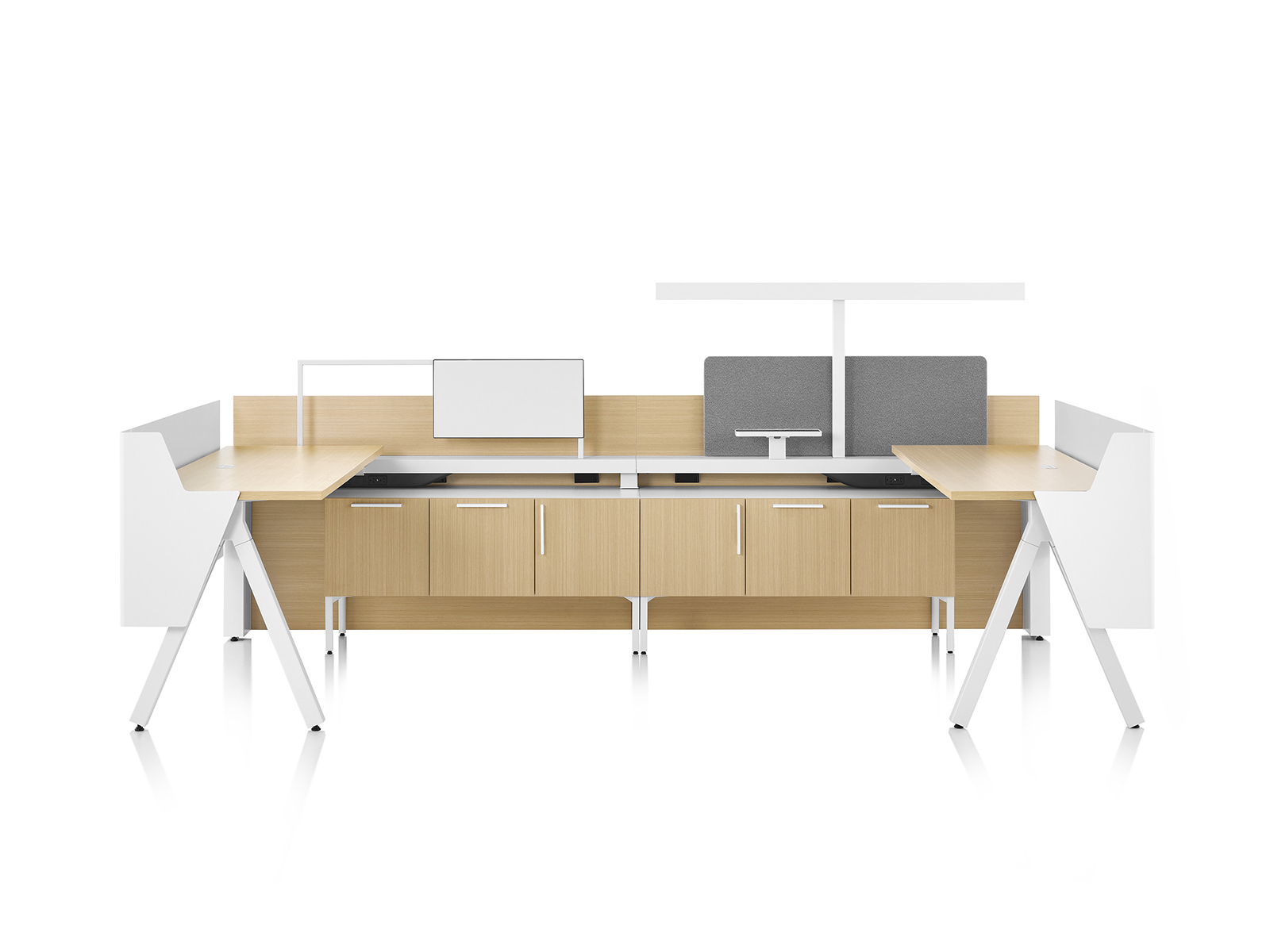 Brown and white Canvas Vista workstations with a-shaped legs, modesty and privacy screens, t-shaped light and gray boundary screens.