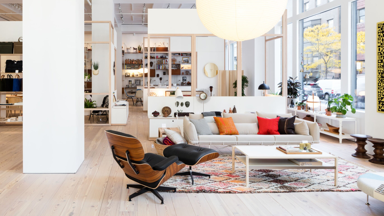 Herman Miller's New York showroom featuring an Eames Lounge Chair and Ottoman and a Wireframe Sofa.