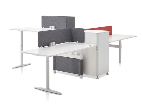 A cluster of three Atlas Office Landscape height-adjustable workstations designed for collaboration. A cluster of three Atlas Office Landscape height-adjustable workstations designed for collaboration.