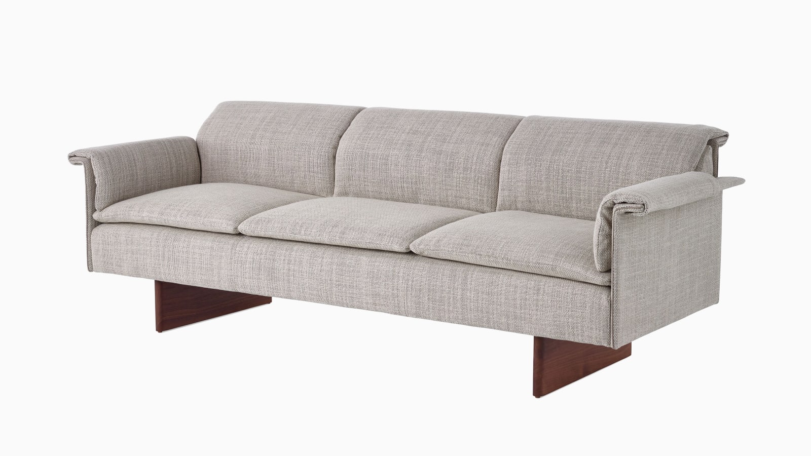 Mantle Three Seater Sofa in Capri Stone with Walnut Wood Base, viewed at an angle.
