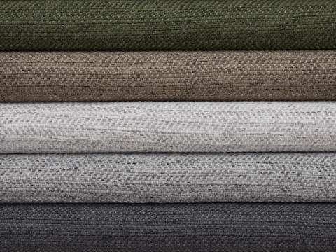 Multiple folded Dex fabric swatches in varying colors including neutrals, greens, browns, and grays.