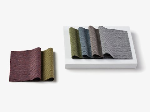 Two stacks of folded samples representing the Parcel fabric family.