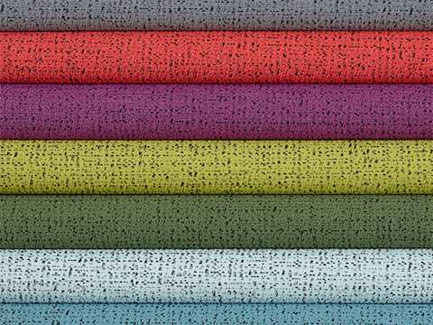 Multiple folded 100% recycled content fabric swatches in varying colours including neutrals, reds, greens, blues and purples.
