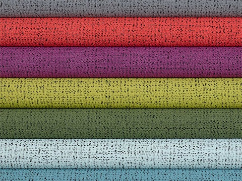 Multiple folded 100% recycled content fabric swatches in varying colors including neutrals, reds, greens, blues and purples.