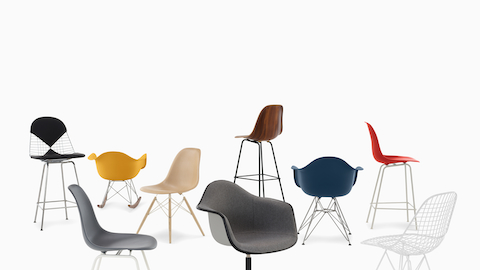 A casual arrangement of Eames shell chairs and stools in fiberglass, wire, wood, and plastic.