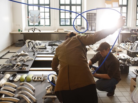 Designer Carola Zwick and engineer Roland Zwick test materials for the Mirra 2 office chair at Studio 7.5.