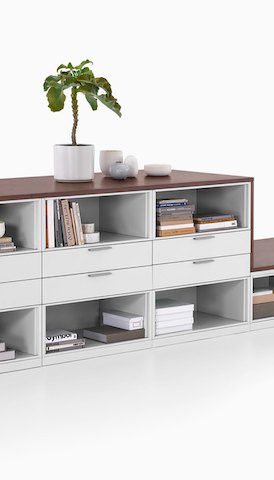 A storage unit with drawers and shelves. Select to go to the Storage product page.
