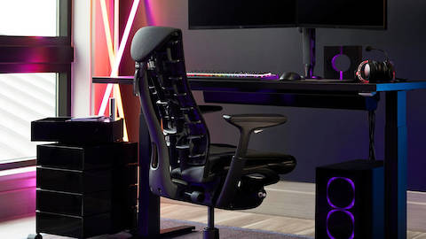 A gaming set up featuring the Embody Gaming chair and Motia Desk by Herman Miller.