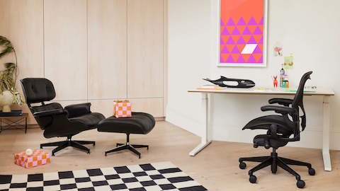 Eames Lounge Chair and Ottoman, Girard Check Rug, Nevi Sit to Stand Table, Aeron Chair, Eames House Whale, Nelson Pop Art Triangles Poster