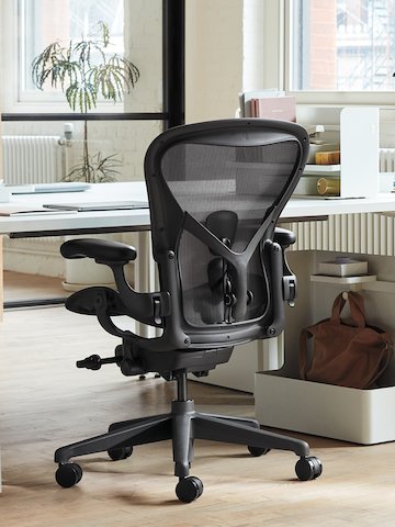 An Aeron Chair at a desk in an office area.