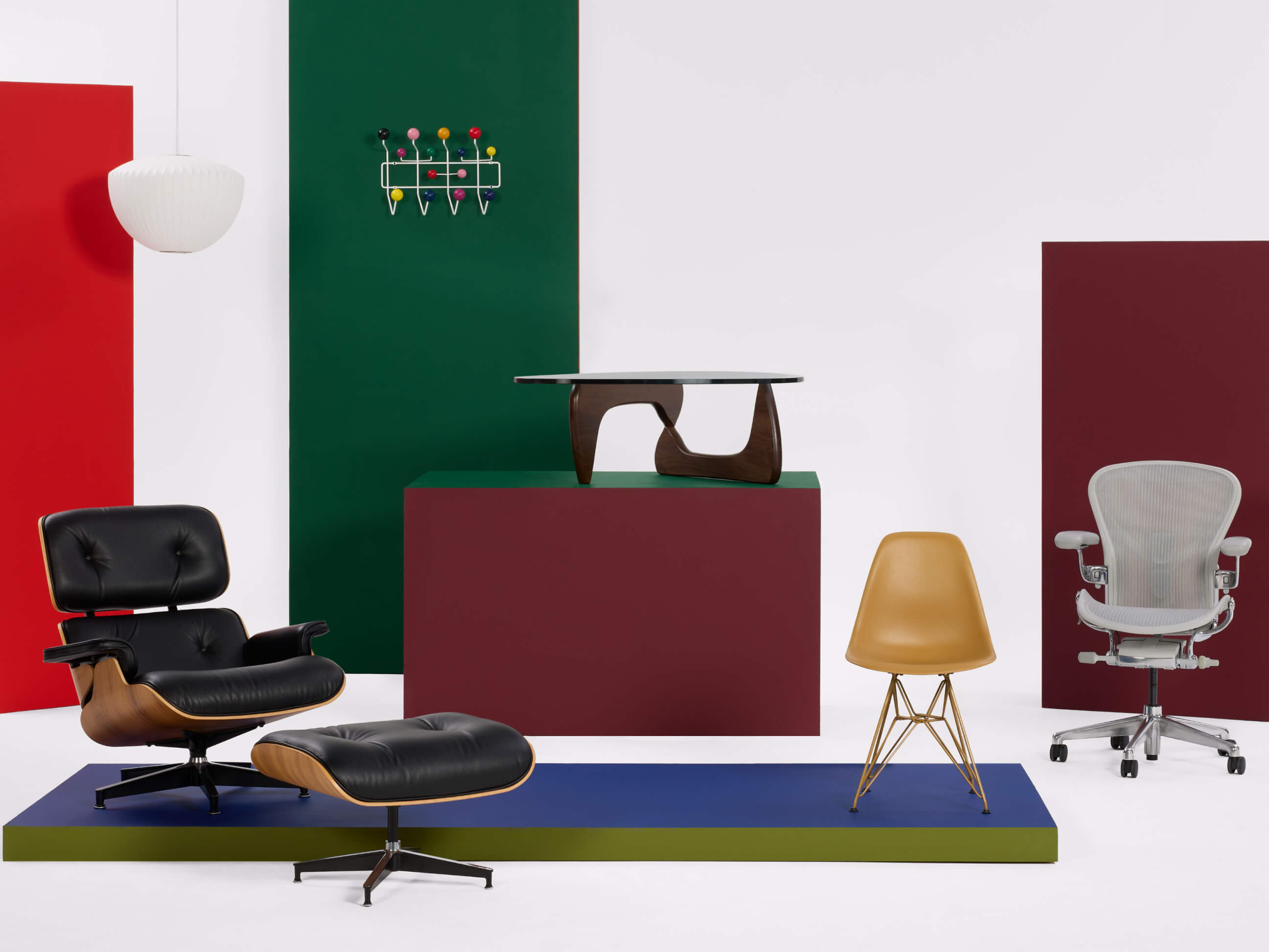 Eames Lounge and Ottoman, Noguchi Table, Eames Hang it all and Side chair, Aeron Chair and Nelson Bubble lamp.