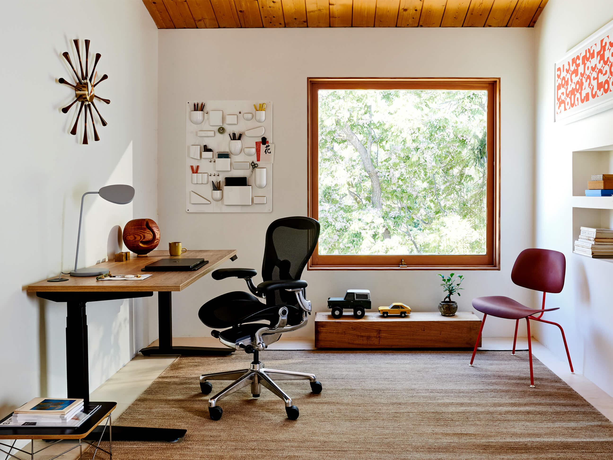 Aeron Chair and Motia Sit-to-Stand Desk form the foundation for a modern home office, alongside Eames classics like Wire Base Low Table and EC-127.