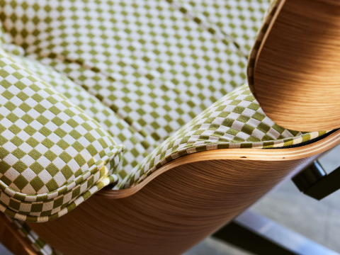 Detail of Eames Lounge Chair in White Oak and Emerald / Light Ivory Checker.