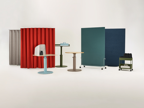 An assortment of OE1 Workspace Collection products in bright colors, including freestanding curtains, sit-to-stand tables and storage.