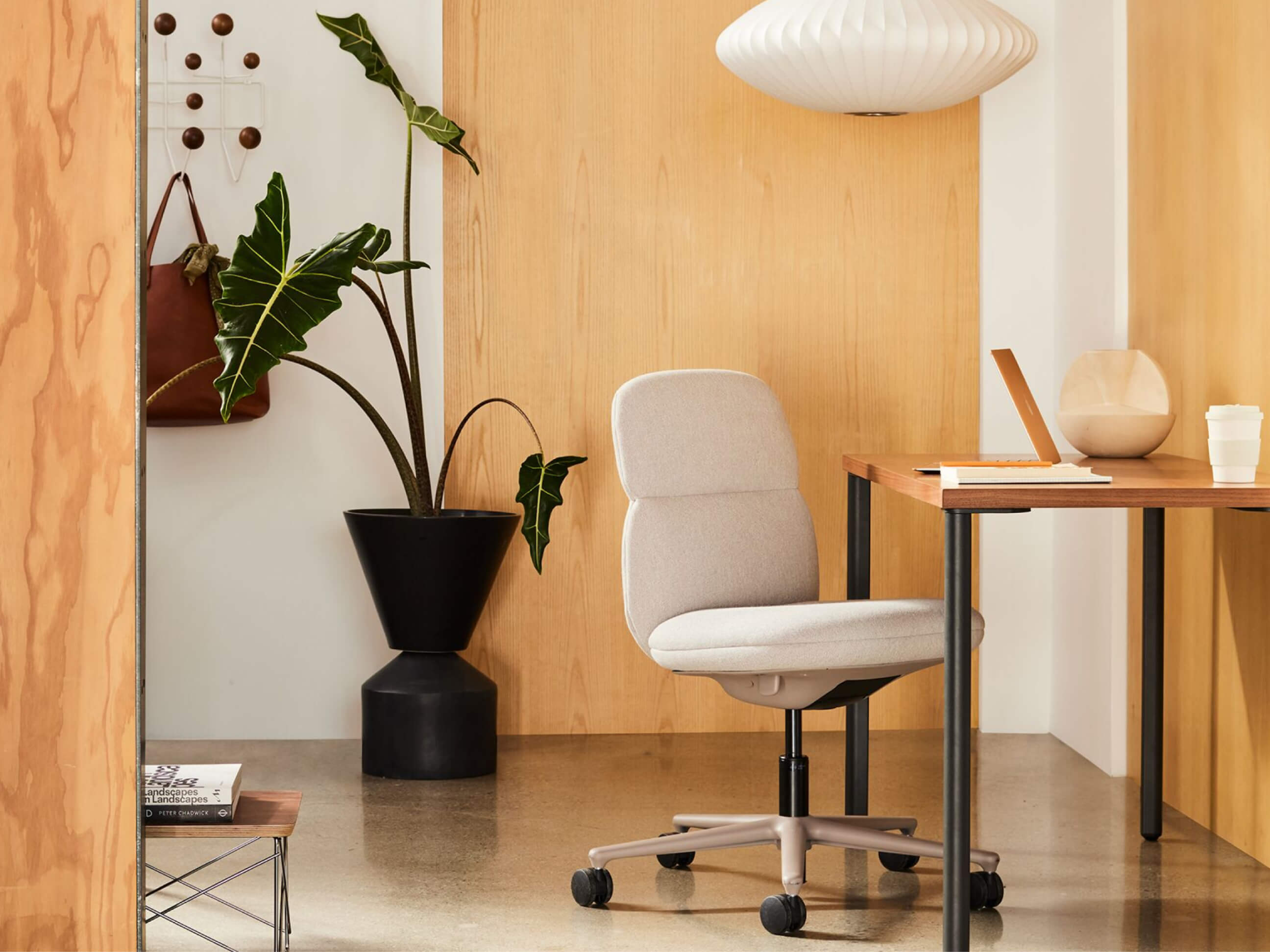 A modern work setup featuring the Asari Chair by Herman Miller. 