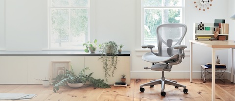 Aeron Chair in Mineral seen from the front in a home office setting.