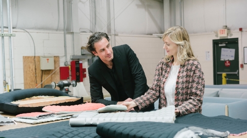 Designers Stefan Scholten and Carole Baijings review textile samples.