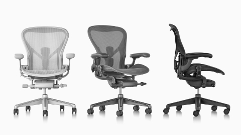 Three Aeron office chairs viewed from different angles.