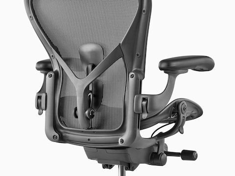 A black Aeron office chair, viewed from the rear and showing the back support. A black Aeron office chair, viewed from the rear and showing the back support.