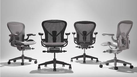 Four Aeron chairs in Carbon, Onyx, Graphite, and Mineral
