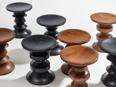 Group of Eames Turned Stools in walnut and ebonized ash.