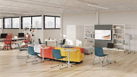 A selection of large Passport Work Tables are featured in a team collaboration setting.