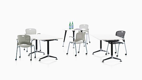 A variety of AbakEnvironments surfaces, surrounded by Caper Stacking Chairs with casters.