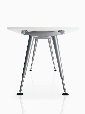 An AbakEnvironments height-adjustable desk, viewed from below the surface to show the twin-beam understructure.