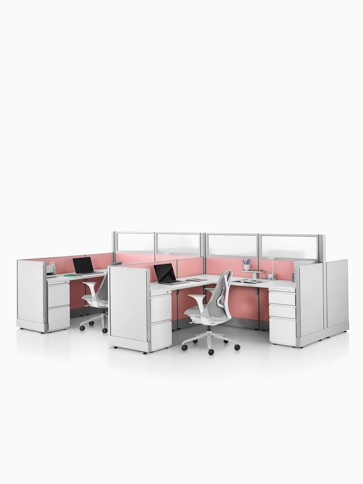 Two Action Office System open workstations with gray Sayl office chairs.