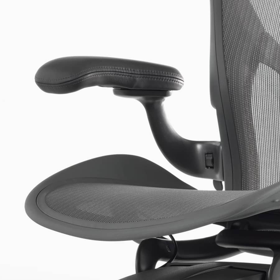 A close-up view of a leather arm pad on an Aeron Chair.