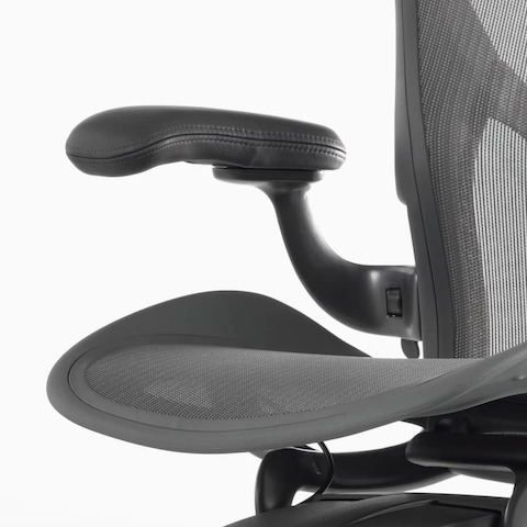A close up view of a leather arm pad on an Aeron Chair.