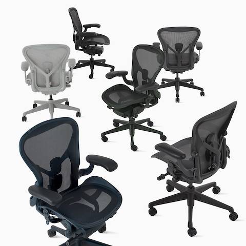 Seis Sillas Aeron agrupadas, en gris oscuro, gris, gris claro, negro, verde oscuro y azul oscuro.