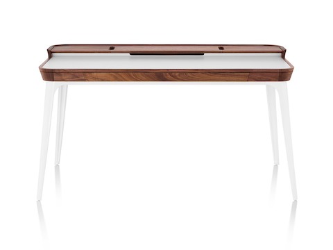 Front view whitesweep of Herman Miller Airia Desk in white with dark wood trim and white legs. Front view whitesweep of Herman Miller Airia Desk in white with dark wood trim and white legs.