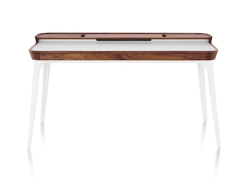 Front view whitesweep of Herman Miller Airia Desk in white with dark wood trim and white legs.