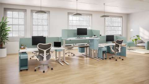 Open floorplate with six height-adjustable tables accented with Ambit Workspace Solutions in glacier and Mirra 2 chairs.