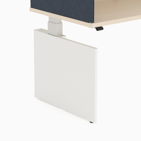 Exterior view of white metal shroud attached to a height adjustable table.