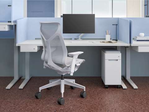 Height- adjustable workspace with light blue Ambit Screens and white Ambit small suspended storage and mobile pedestal storage.