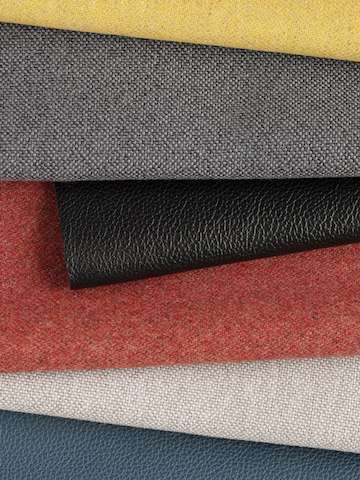 Swatches of Maharam Luce, Meld and Stow leather in multiple colors folded against each other.