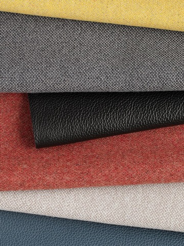 Swatches of Maharam Luce, Meld and Stow leather in multiple colors folded against each other.