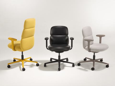 A group of three Asari chairs by Herman Miller all with height adjustable arms. Included in this group are a mid back light brown chair, a high back yellow chair and a mid back black leather chair.